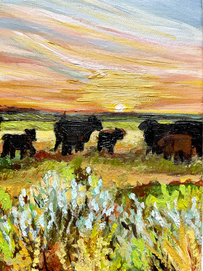 Painting of cows in a field with a sunset sky