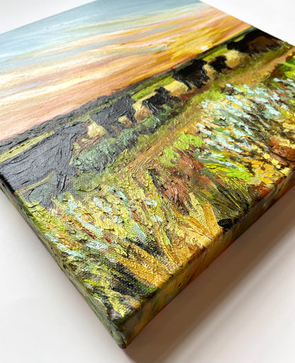 Painting of cows in a field with a textured surface