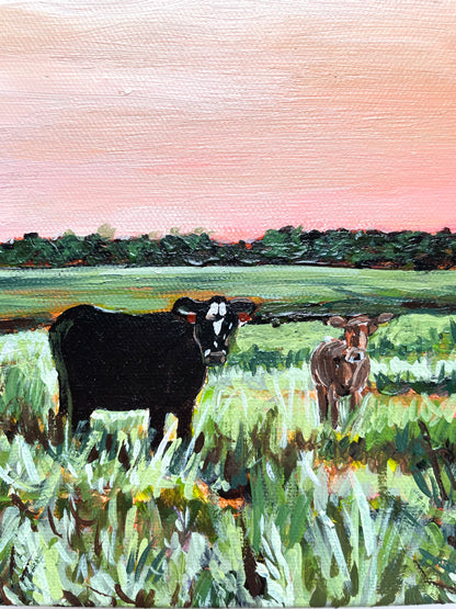 Painting of two cows in a field with a pink sky