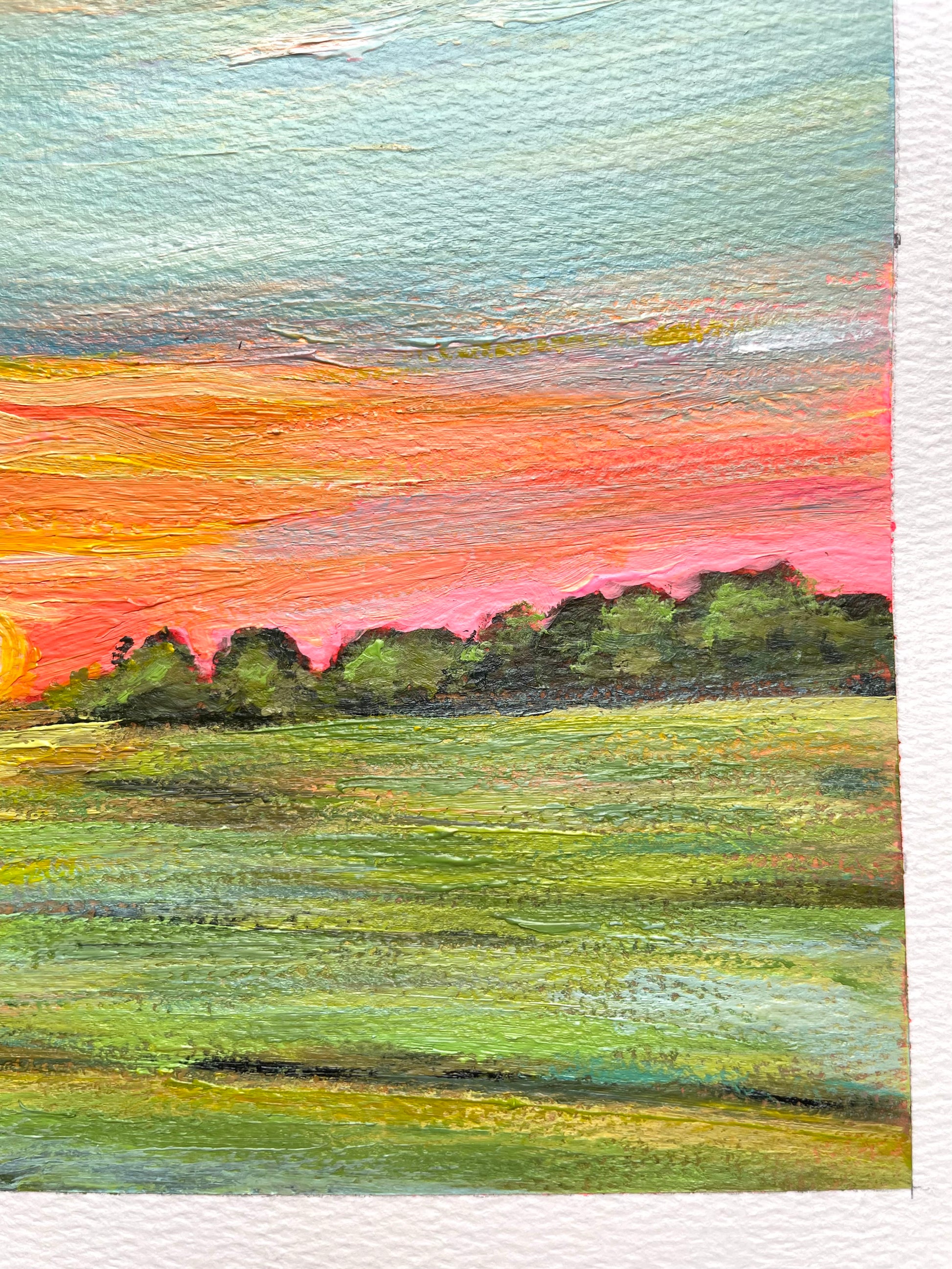 Painting of a sunset over a field with trees
