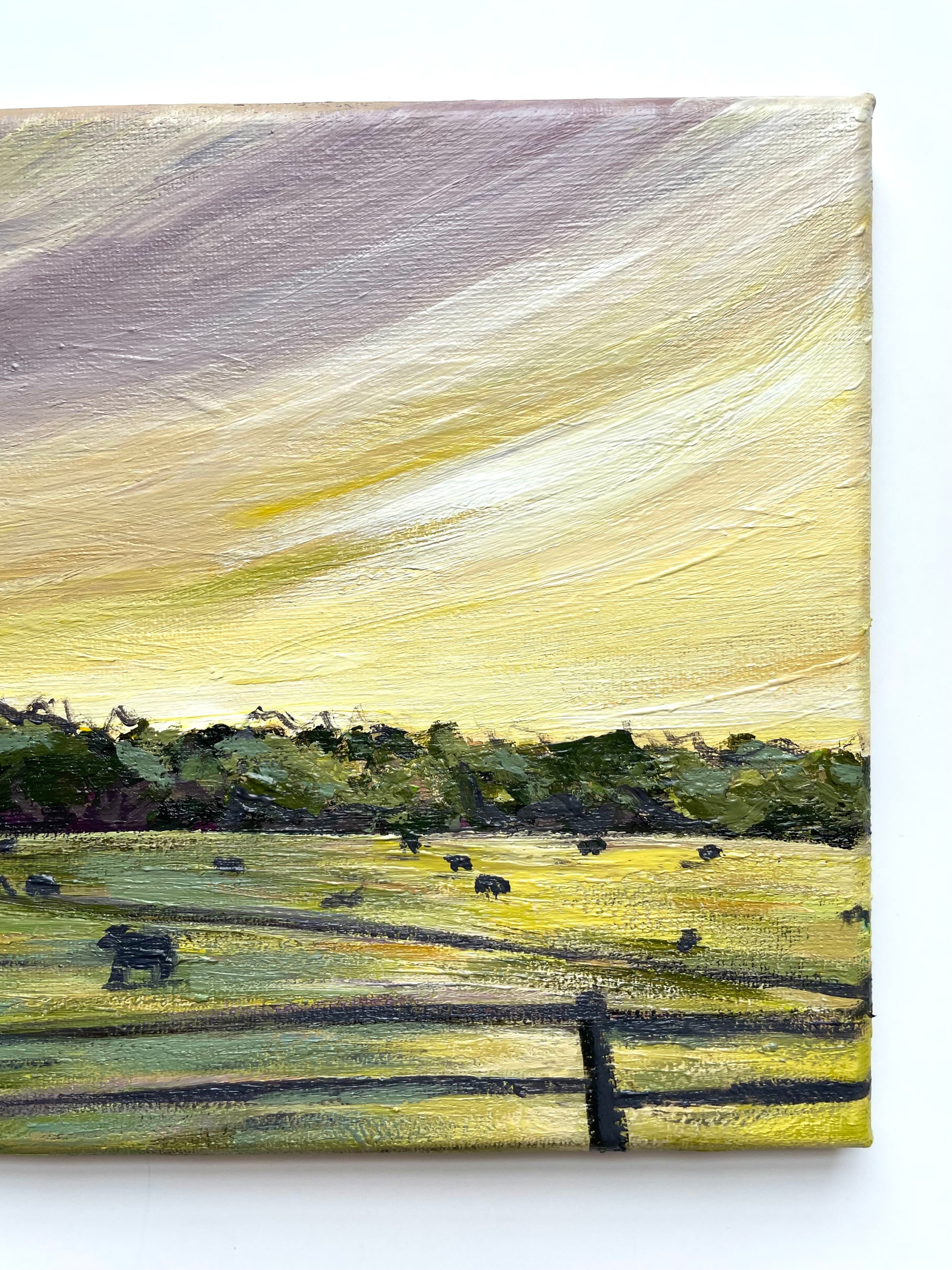 Painting of a landscape with fields, trees, and animals with a purple and yellow sky